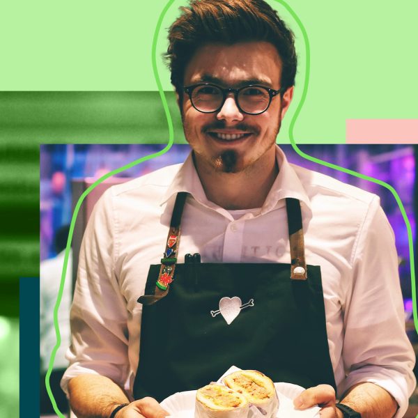 Man standing with plate of food in his hands