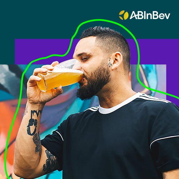 A person drinking from a pint glass