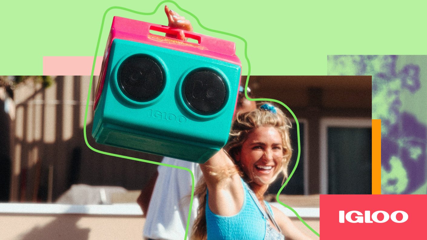 A person holding a boom box