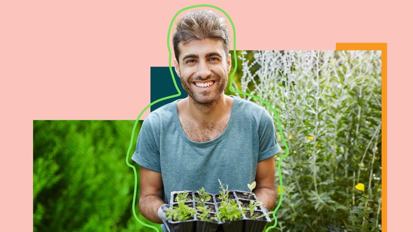 Man smiling while gardening