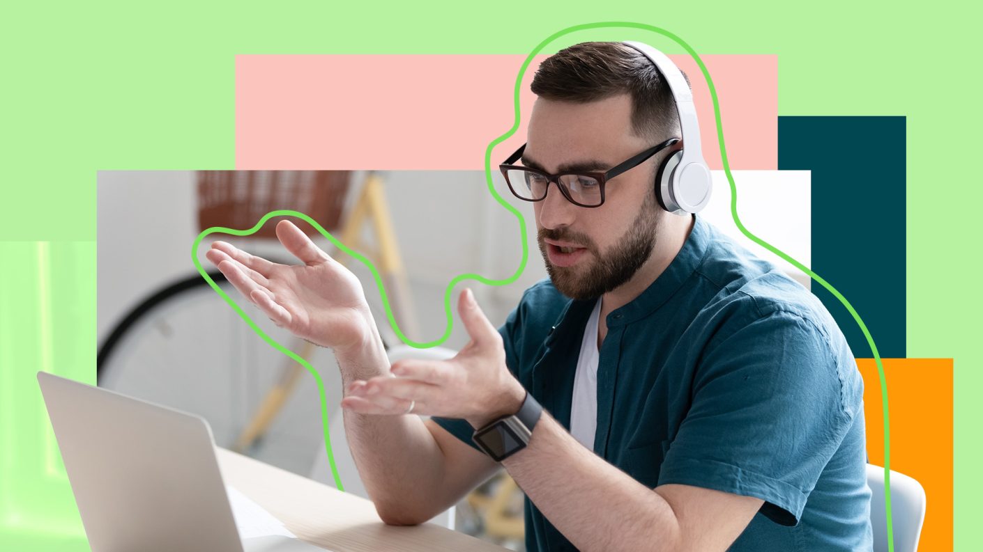 Person with headphones talking to computer screen