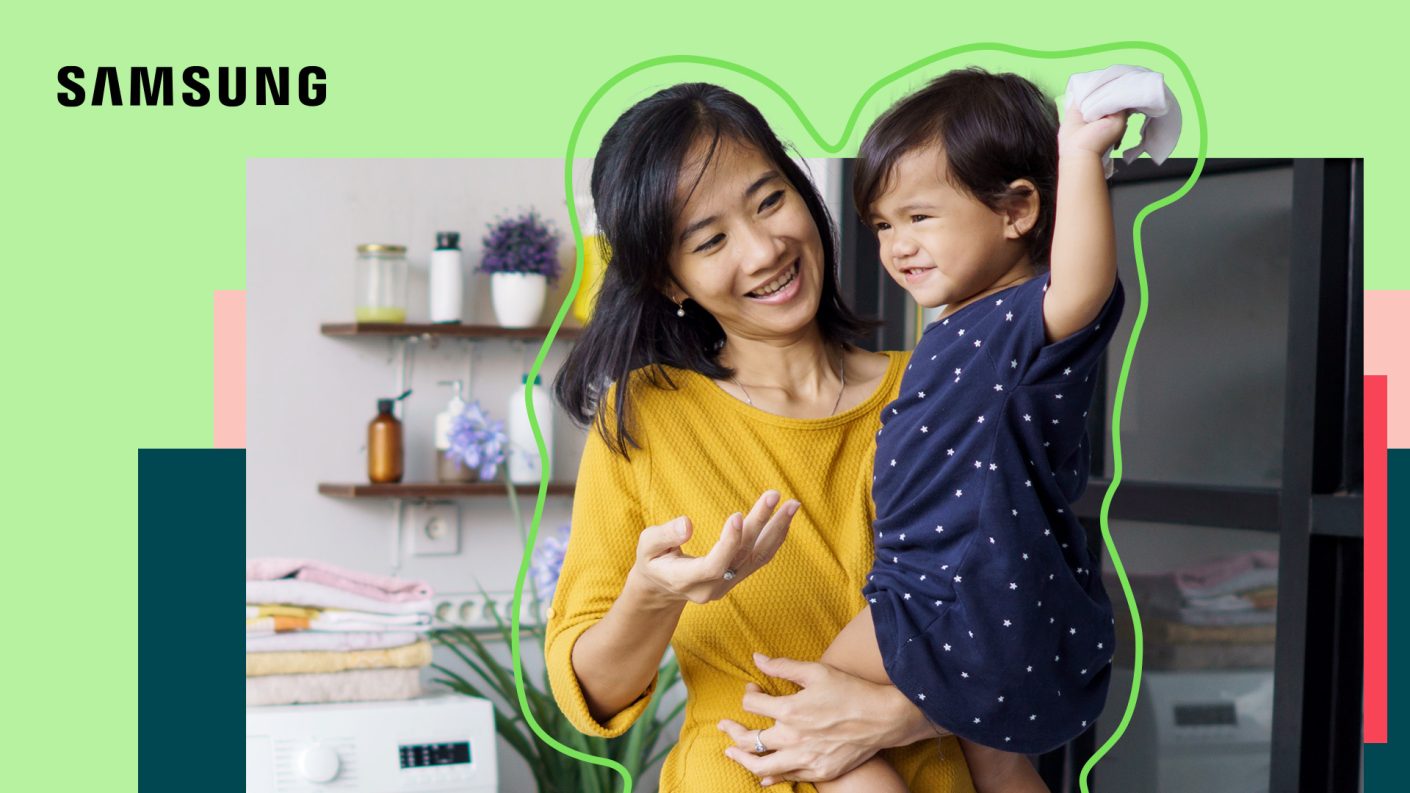 Mother holding child in laundry room