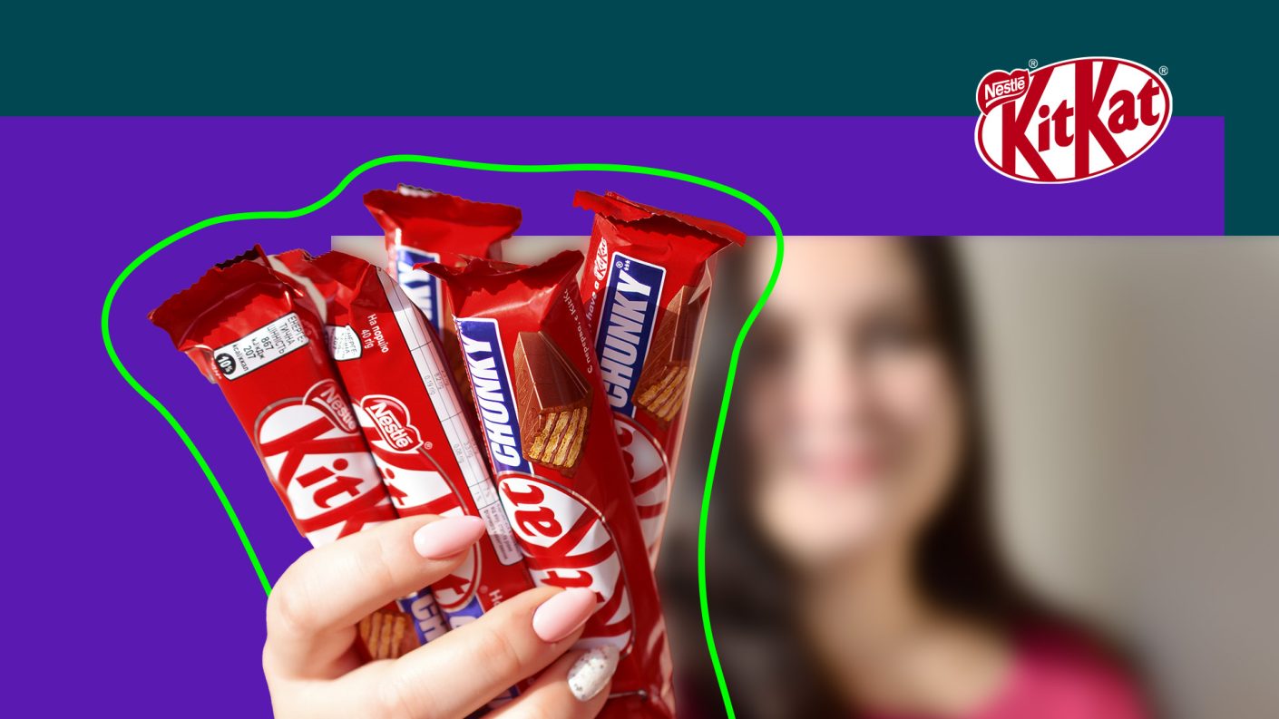 Woman showing KitKat bars in her hand