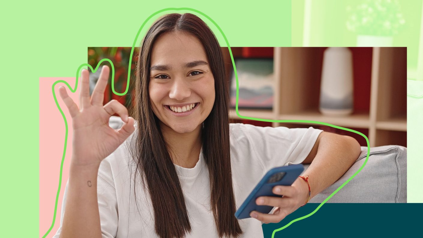 Young woman making an OK sign