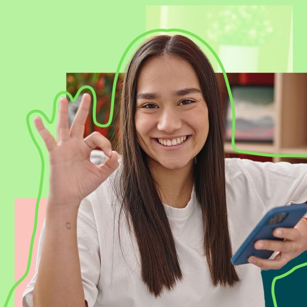 Young woman making an OK sign