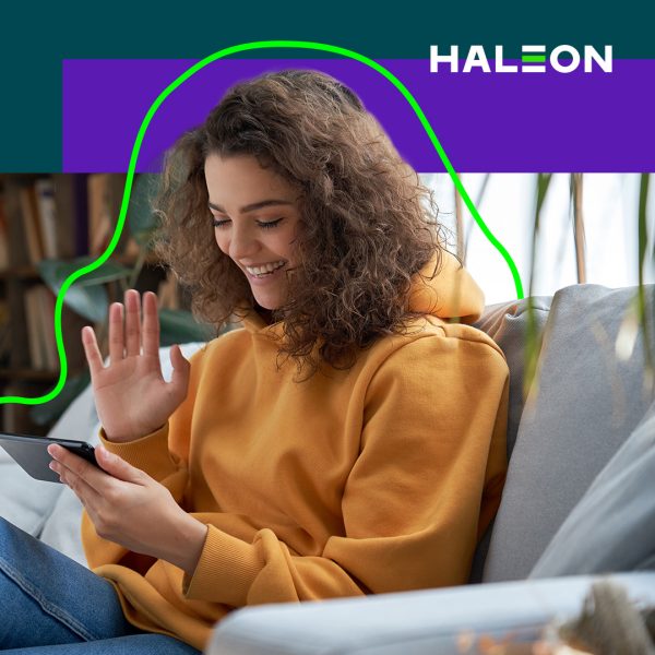 Woman waving at her smartphone