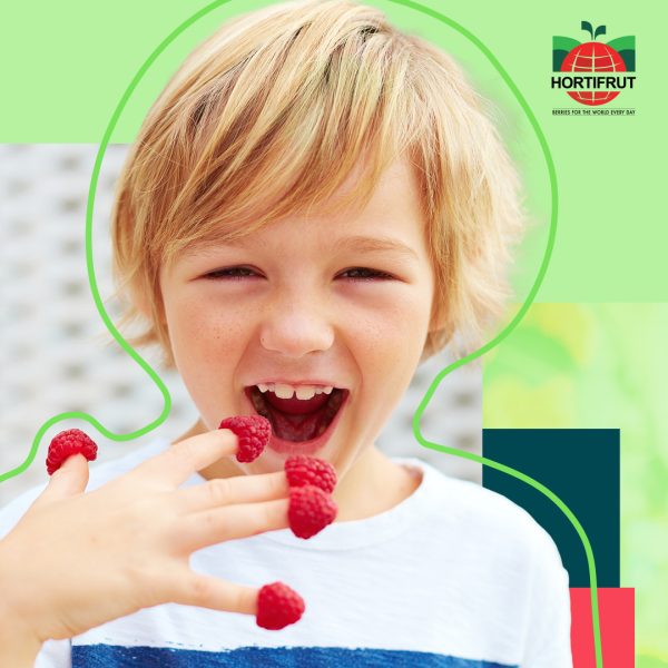 Child with raspberries on top of his fingers