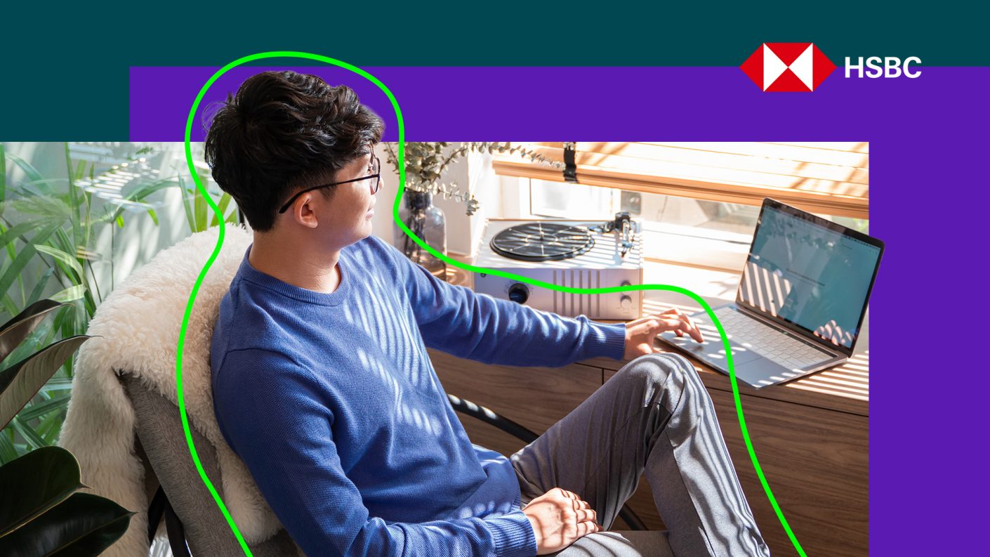 Young man looking at laptop