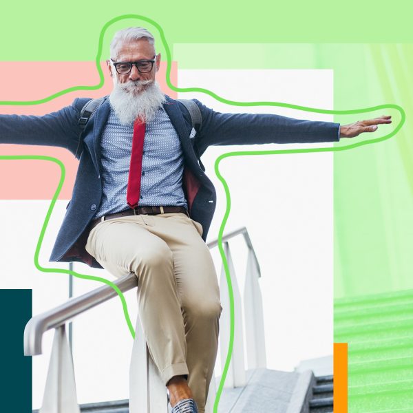 Hipster man sliding down stairs