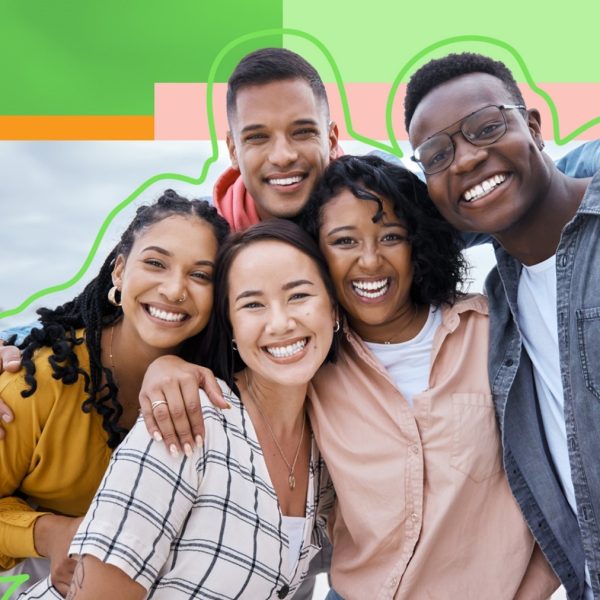 5 people hugging and smiling at the camera