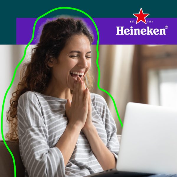 Woman sitting enthusiastic behind her computer