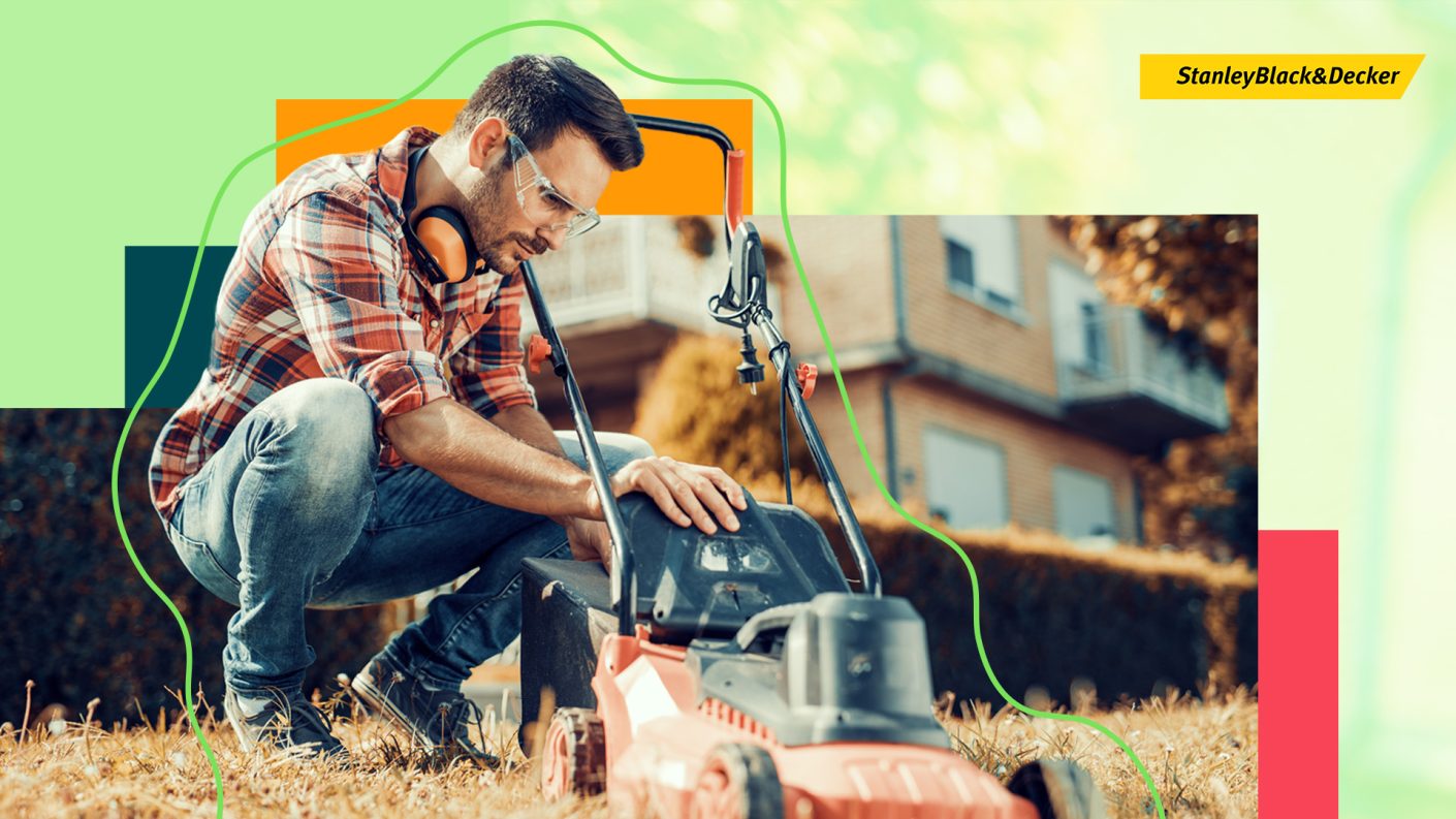 Man checking lawn mower