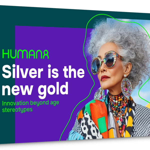 Report cover, showing a colourfully dressed woman with grey hair