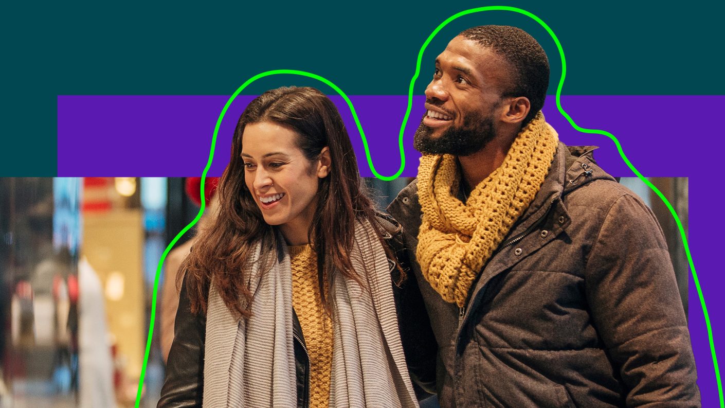 Man and woman looking around, shopping