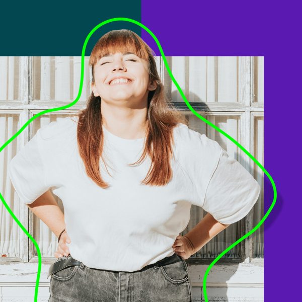 Woman smiling at camera with eyes closed