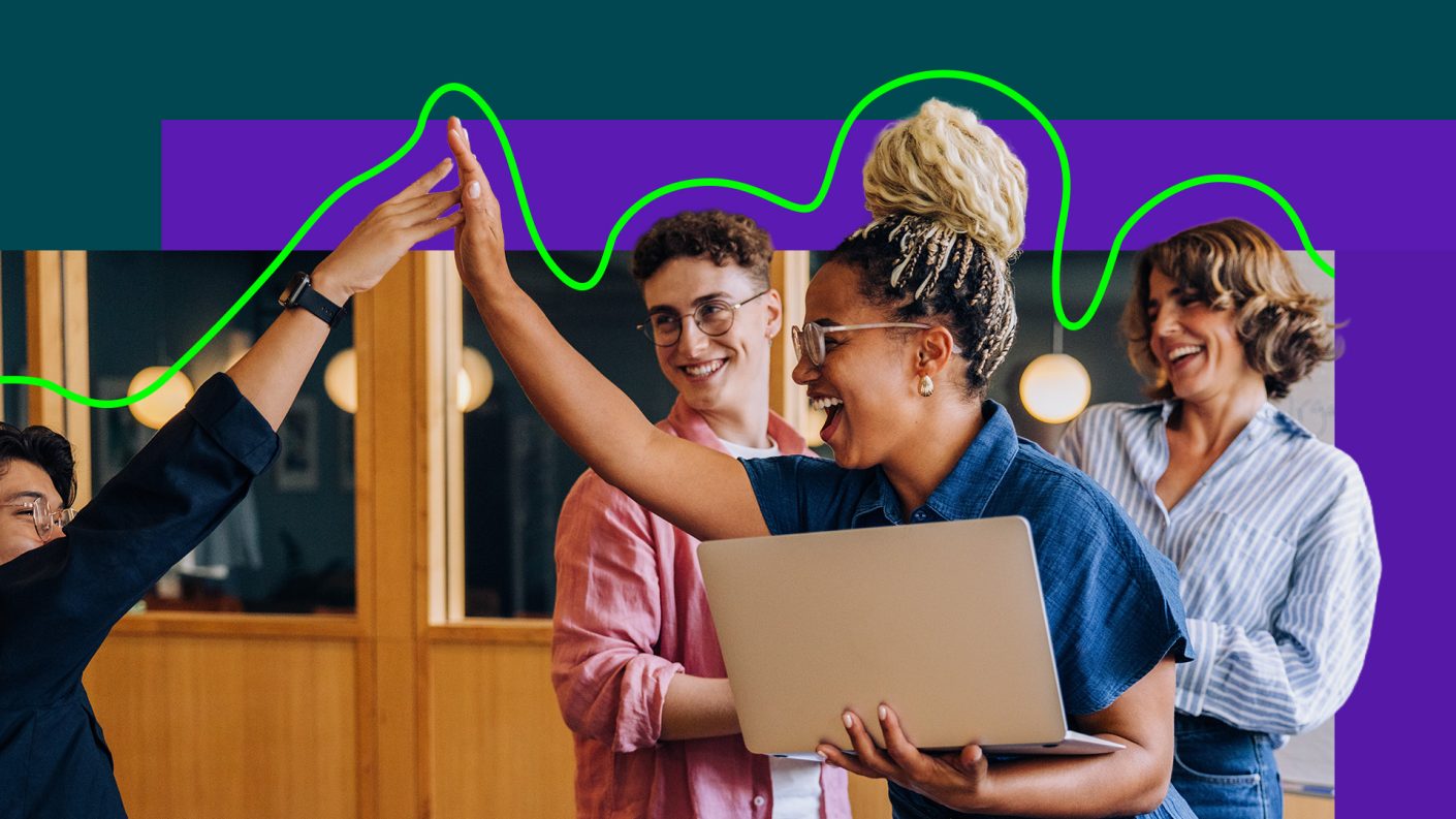 People in a business context giving a high five