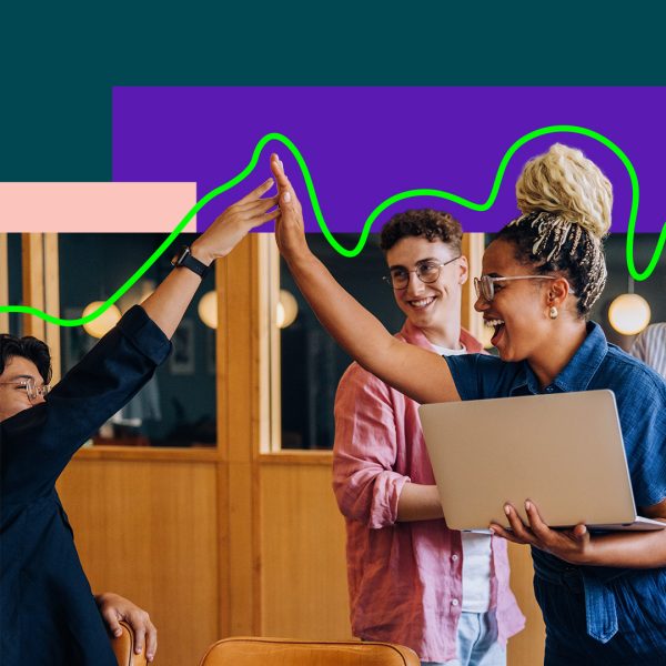 People in a business context giving a high five